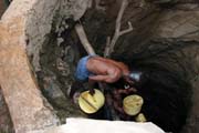The water is retrieving from 10m deep well by men-chain to small reservoir. Men are singing for better synchronization. Singing well, Dublock. Ethiopia.