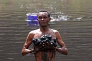 The salt is retrieving from the lake without any mechanization. Salt Lake, El Sod. Ethiopia.