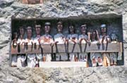 Tau tau figures in front of graves at Lemo. Tana Toraja area. Sulawesi,  Indonesia.