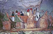 Old graves at cave. Tau tau figures and ship=shaped cofins. Tana Toraja area. Sulawesi, Indonesia.