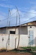 Ouidah town is the centre of the Voodoo cult which is very live here. White flag is symbol that the owner of the house practices Voodoo cult especially 