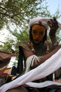 Man from nomadic Wodaab tribe (also called Bororo) prepares himself for Yaake dance. Gerewol festival. Niger.