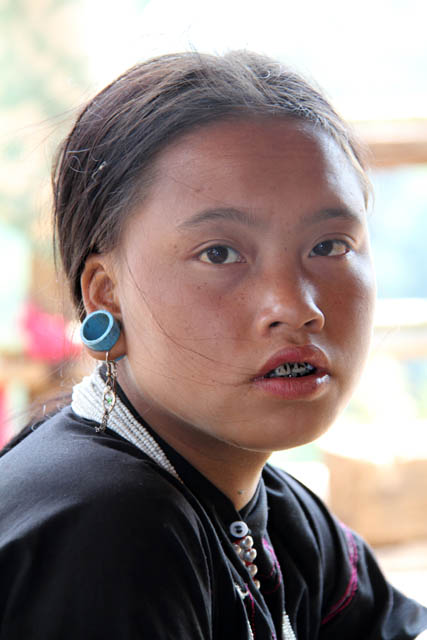 Girl from Eng tribe (sometimes called Ann or black teeth people), area around Kengtung town. Myanmar (Burma).